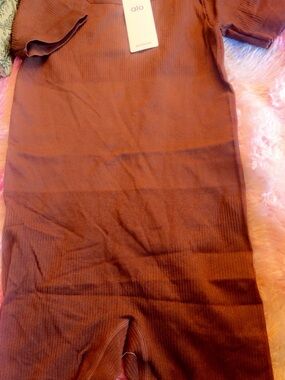 ALO Yoga Ribbed Short Sleeve Jumpsuit in Rust